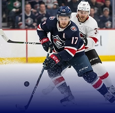Ice hockey player skating with the puck